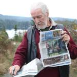 Guy Simmons performs the tear and repair magic trick with a copy of Sooke News Mirror. (Ben Fenlon/Sooke News Mirror)