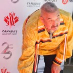 Graham Greene places his hand in his Canada Walk of Fame Star.