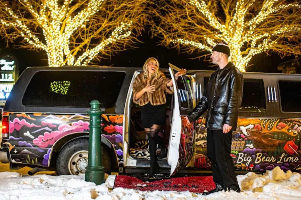 A passenger enjoys a ride around Revelstoke with Big Bear Limousine.