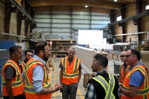 MLA Roly Russel, Minister of State for Trade Jagrup Brar, and Okanagan Falls Director Matt Taylor were given a tour of the Mercer Mass Timber facility in Okanagan Falls on July 17. Pictured is Brar speaking with Mercer employees Travis Hiller, Brian Merwin and Greg Johnston.