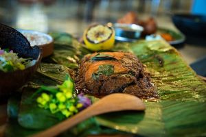 Cafe Malabar's Fish Pollichathu - tender fish wrapped in banana leaf and seasoned with aromatic spices is a favourite among regular diners.