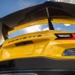 Rear view of Chevrolet Corvette ZR1 Coupe with ZTK Performance Package, looking up at the carbon fiber rear wing and blue sky. Preproduction model shown. Actual production model may vary. Photos: Chevrolet