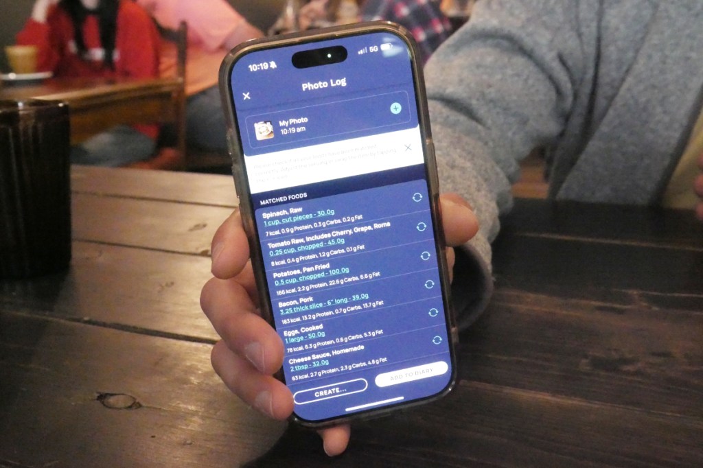 Cronometer product team manager Brendan Benson shows the app's newest feature, a meal scanner for assessing nutritients, at Revelstoke's Flourish Bakery on Friday, Sept. 26.