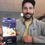 Cronometer product team manager Brendan Benson shows the app's newest feature, a meal scanner for assessing nutritients, at Revelstoke's Flourish Bakery on Friday, Sept. 26.