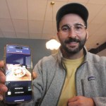 Cronometer product team manager Brendan Benson shows the app's newest feature, a meal scanner for assessing nutritients, at Revelstoke's Flourish Bakery on Friday, Sept. 26.