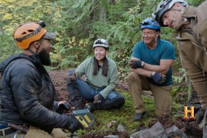 (left to right) Kru Williams, Taylor Starr, Don Froese and Adam Palmer of 'Deadman's Curse' gather in the Harrison Lake area to discuss their latest findings in the hunt for Slumach's gold.