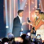 Owen Reigling and Alexandra Kay presenting Cameron Whitcomb with an award at the 2025 CCMA Awards.