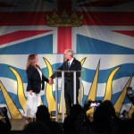 Conservative Party of B.C. Leader John Rustad welcomes his wife, Kim, on stage for his speech at the party's election night headquarers. He credited her for taking on the Conservative leadership.