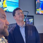 Conservative candidate Adam Hayduk, right, watches the 2024 election results at Boston Pizza in Port Alberni with his campaign manager Mike Butler.