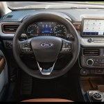The 2024 Ford Mavericks interior features knobs and buttons controlling most functions, including the audio and ventilation systems plus an oversize rotary control for gear selection. Courtesy Ford