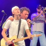Surrey resident Jackson Newson (in hat) with Arkells singer Max Kerman on stage at Barnside Harvest Festival in Ladner on Saturday, Sept. 13, 2025.