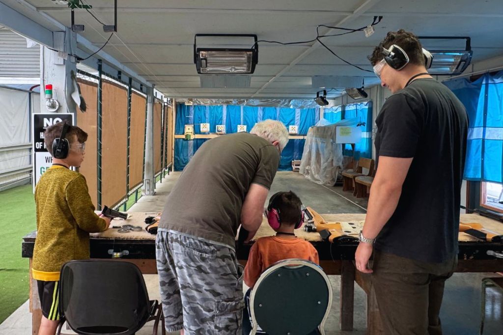 Family day with dad (standing) and his sons being coached by an NSRG member.