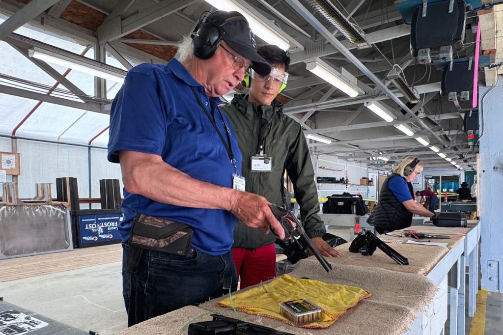 Gary Byrne gives Ryan Fathi instructions on how to load the vintage Colt 537 Python revolver