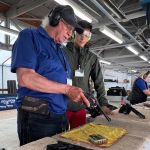 Gary Byrne gives Ryan Fathi instructions on how to load the vintage Colt 537 Python revolver