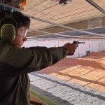 Ryan Fathi shoots at a range with balloon targets.