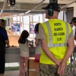North Saanich Rod & Gun Club coaches making sure the girls are prepped before jusing the pistols on Bay 2. Harry Corro/Peninsula News Review
