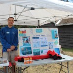 Levi from the Bulkley Valley Pool hangs out behind the Telkwa Reading Room to educate people on drowning prevention.