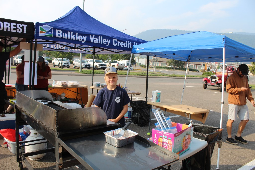Smithers Fire Rescue's Fire Chief Alle Jan de Vries' son Sijtse de Vries mans the BBQ.