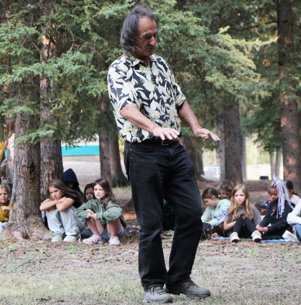 Tony Solomon blesses the land before erecting a teepee at Horse Lake Elementary School. (Patrick Davies photo - 100 Mile Free Press)