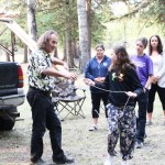 Tony Solomon directs Kiera Bracey on how to build a teepee at Horse Lake Elementary School. (Patrick Davies photo - 100 Mile Free Press)