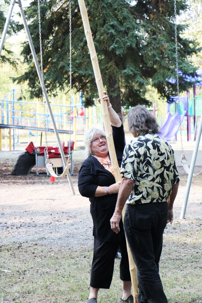 Horse Lake Elementary School's indigenous support worker Jodi Thomson listens to Mukwa Teepee owner and founder Tony Solomon on Wednesday, Sept. 17. (Patrick Davies photo - 100 Mile Free Press)