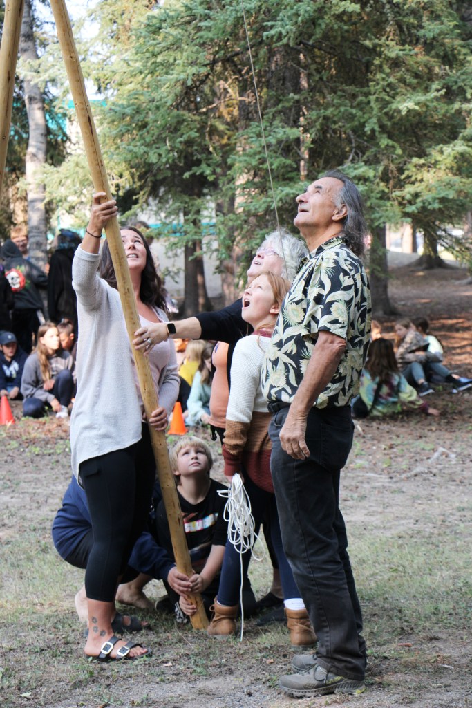 Nicole Phelan (left), Colter Bishop, Jodi Thomson, Avery Finlayson and Tony Solomon work together to build a teepee at Horse Lake Elementary School. (Patrick Davies photo - 100 Mile Free Press)