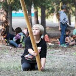Horse Lake Elementary School student Colter Bishop holds a teepee pole in place on Wednesday, Sept. 17. (Patrick Davies photo - 100 Mile Free Press)