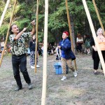 Tony Solomon and Shane Mikkelsen work together to build a teepee at Horse Lake Elementary School. (Patrick Davies photo - 100 Mile Free Press)