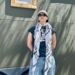 Gina Mowatt standing in front of the tiny home.