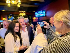 Trevor Halford, seen here  with wife Holly at his election night party at Ocean Park Pizza, is set to claim victory in Surrey-White Rock for the B.C. Conservatives.