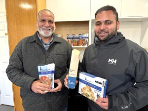 Barakah Eats operators Rushd Khan, right, and his father, Zafar Khan at the company plant in Newton.