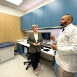 Josie Osborne, B.C. Minister of Health, with Sukhvir Seehra, associate Shoppers Drug Mart owner and pharmacist, inside an examination room at the store's new Pharmacy Care Clinic in Newton on Thursday, March 27, 2025.