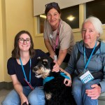 PATS handler Celine Foucher, nurse Kirsten Lambohs and Kimberley Nemrava, placements coordinator for PATS, stop for a photo at Victoria Hospice.