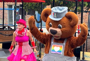 PNE mascot KC Bear dances with a fellow performer at the fair site in Vancouver on Aug. 14, 2025, during a media event. An "All Canadian Street Party" happens twice daily on Miller Drive this year, near the Sands of Wonder sand sculptures.