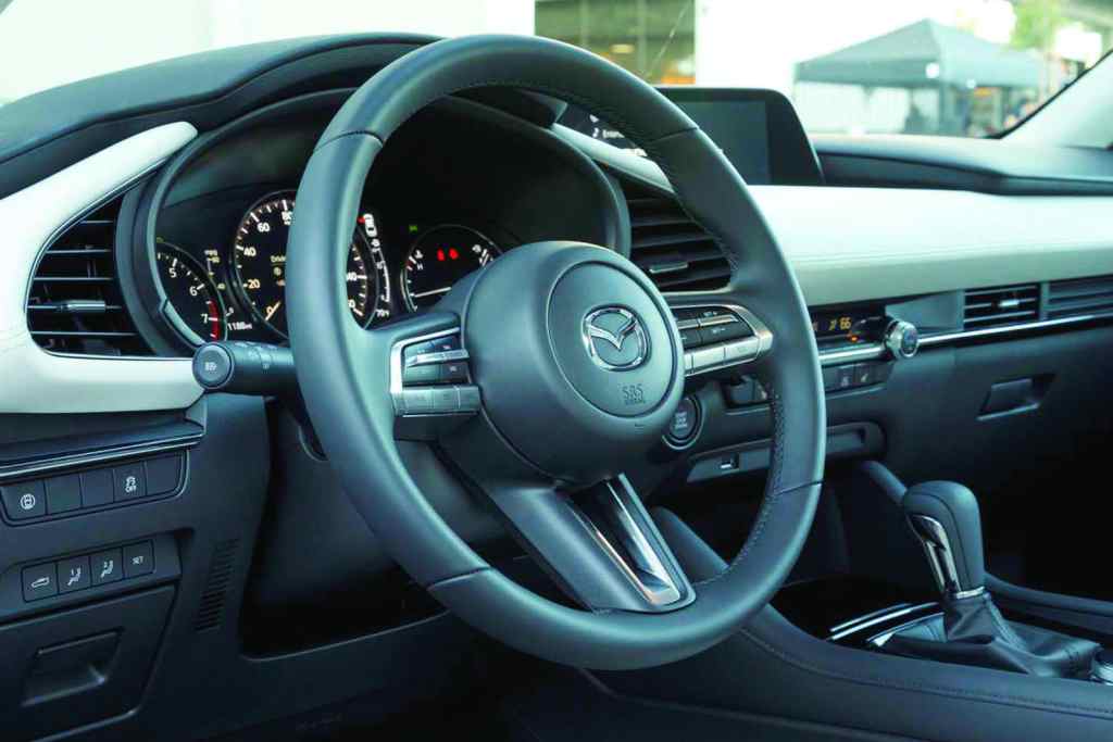 Lately, the focus for the Mazda3 has been on providing premium-finish interiors, even for base trims, that avoid the stripped-down basic-transportation appearance. The instrument cluster has a trio of easy-to-read round gauges is set inside a stylish soft-touch dashboard. PHOTO: MAZDA