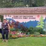 Robi McKnight (left) and Andrea Callison check out the new mural on the pump house while  enjoying a picnic at Riverside Municipal Park. (Sonja Lester)