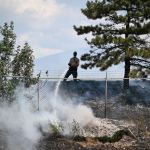 Penticton fire crews are battling a grass fire at Highway 97 and Green Mountain Road on Tuesday, Aug. 5 around 12:40 p.m.