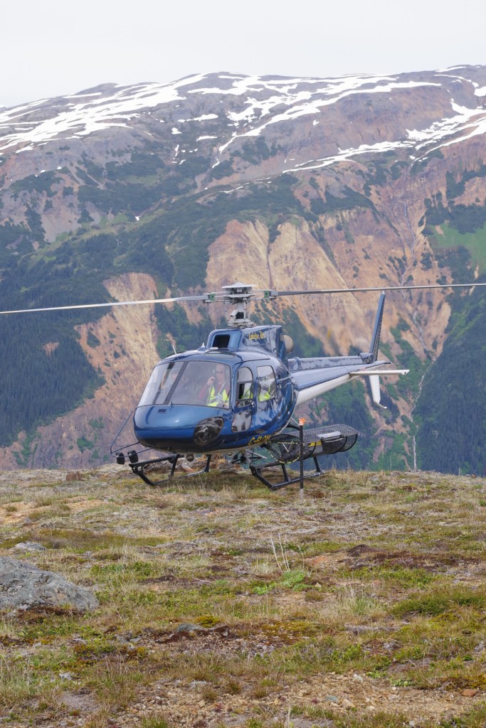 A helicopter lands on top of the Kerr deposit overlooking the Sulphurets deposit at Seabridge Gold's flagship KSM project.