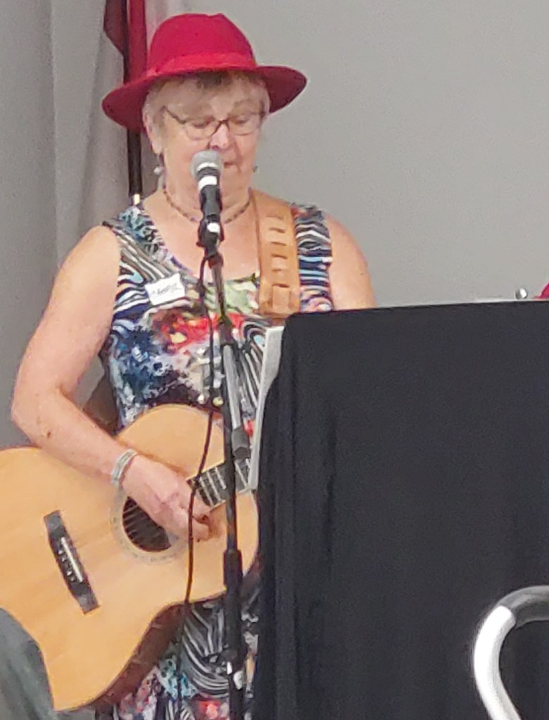 Cheryl Hofweber plays harmonica during the Buddy Up program finale at the Pioneer Senior Centre.