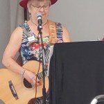 Cheryl Hofweber plays harmonica during the Buddy Up program finale at the Pioneer Senior Centre.