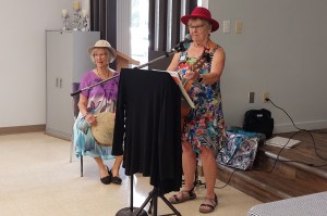 Cheryl Hofweber plays harmonica during the Buddy Up program finale at the Pioneer Senior Centre.