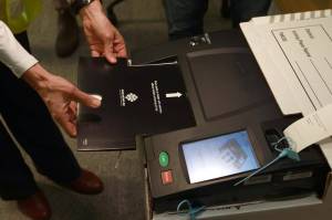 A demonstration of Elections BC's new electronic tabulators, used for the first time in the B.C. election. (THE CANADIAN PRESS/Chad Hipolito)
