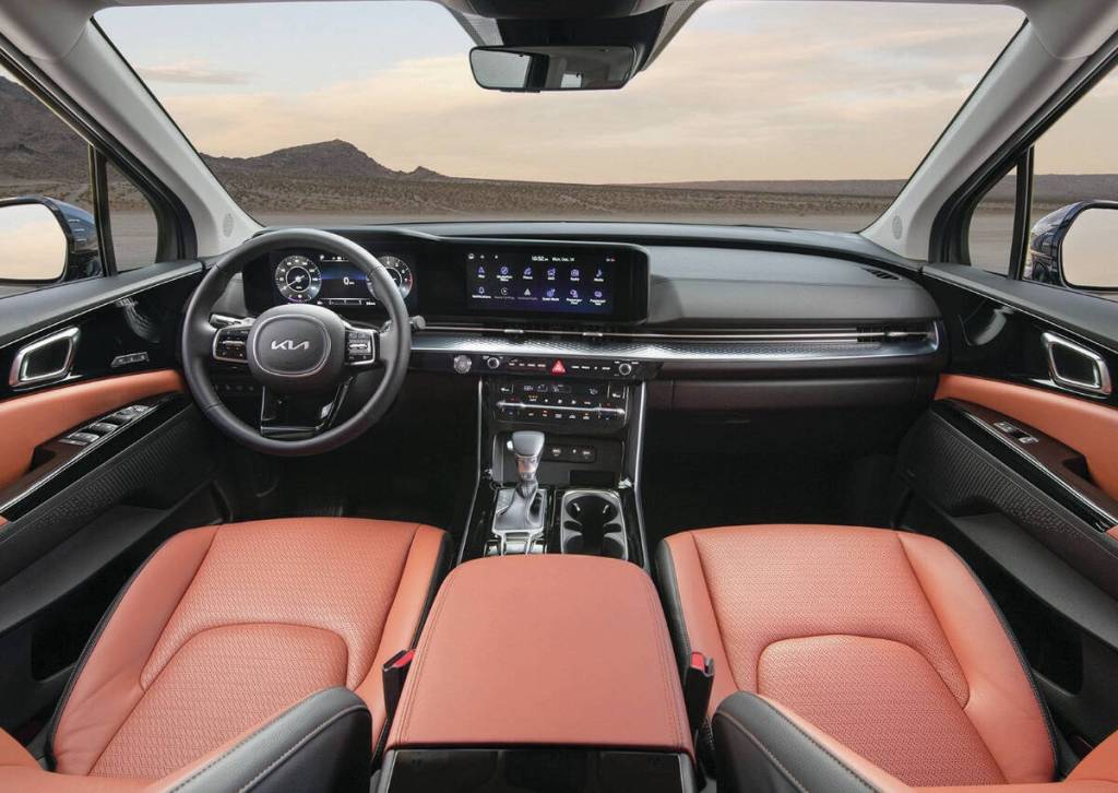 The gauges and touch-screen are contained within a thin panel that stands apart  but is set into  the dash. Passenger room is similar to that of other minivans, but the Carnival has more cargo capacity. PHOTO: KIA