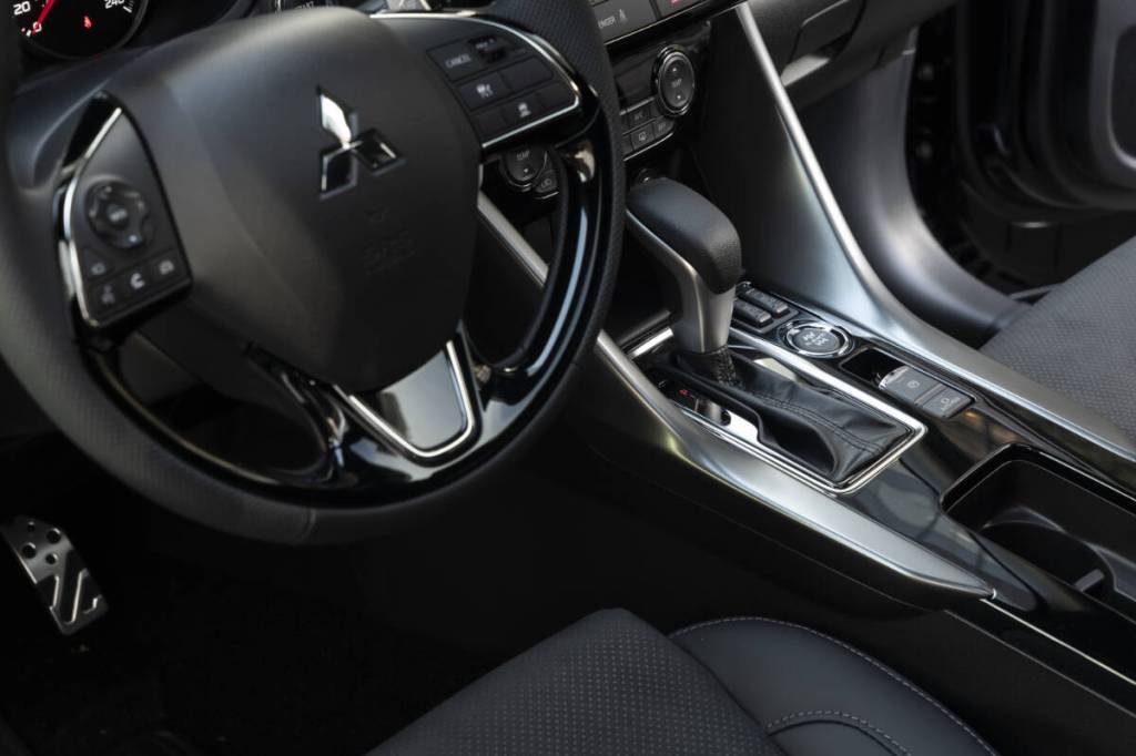Fully embracing its NOIR name, even the steering wheel on the Mitsubishi sport-ute features black and dark silver trim pieces and dark grey accent stitching. Mitsubishi photo