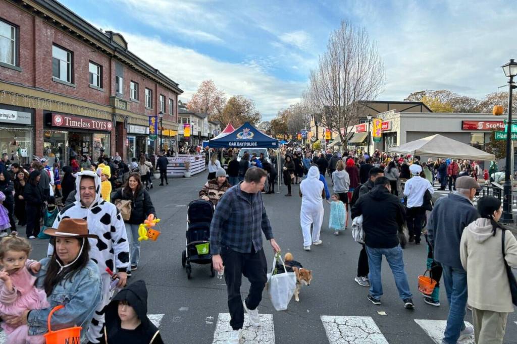 Hundreds gather in Oak Bay Avenue for the Trick or Treat on the Avenue event. (Black Press file photo)