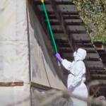 A CFIA worker covers up a camera on the Edgewood farm.