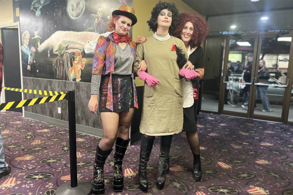 Salomee Kokot, left, as Columbia, Isa Lampers as Dr. Frank-N-Further, and Pascale Kull as Magenta, are ready to take part in the 50th Anniversary screening of The Rocky Horror Picture Show in Williams Lake. (WL Film Club photo)