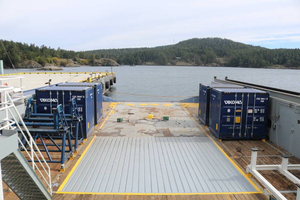 On the back deck of the K.J. Gardner four seacans contain 1,000 feet of offshore boom each. (Ben Fenlon/Sooke News Mirror)