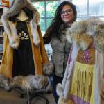 Jeweler and textile artist Naomi Bourque shows off two of the 10 ponchos she designed that were worn on runways at the Indigenous Fashion Arts festival in Toronto in 2024. She has graduated from three programs at Kootenay Studio Arts: jewelry, textile arts, and metal arts. (Tyler Harper/Nelson Star)