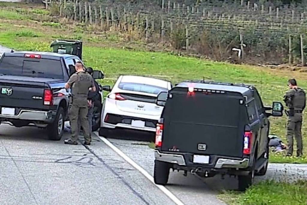 Two black unmarked RCMP vehicles block in a white Hyundai driven by a suspect who allegedly picked up three border-jumpers in Abbotsford on Oct. 8. (BC RCMP photo)
